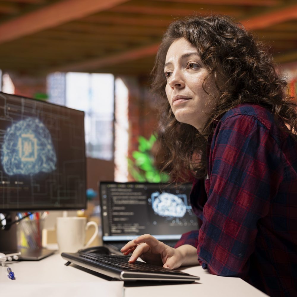 System administrator in startup office coding advanced AI algorithm and machine learning models enhancing automation. IT specialist using PC in artificial intelligence Silicon Valley workplace